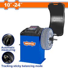 download 2 2 - pricemagicgh.com Wheel balancer with a tire mounted on the spindle; blue base, digital display, and accessory arms, labeled 10"–24" for tire size range.