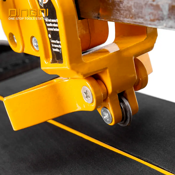 2026/06/1002336892.png - pricemagicgh.com Close-up of a yellow industrial clamp securing a piece of material for cutting.