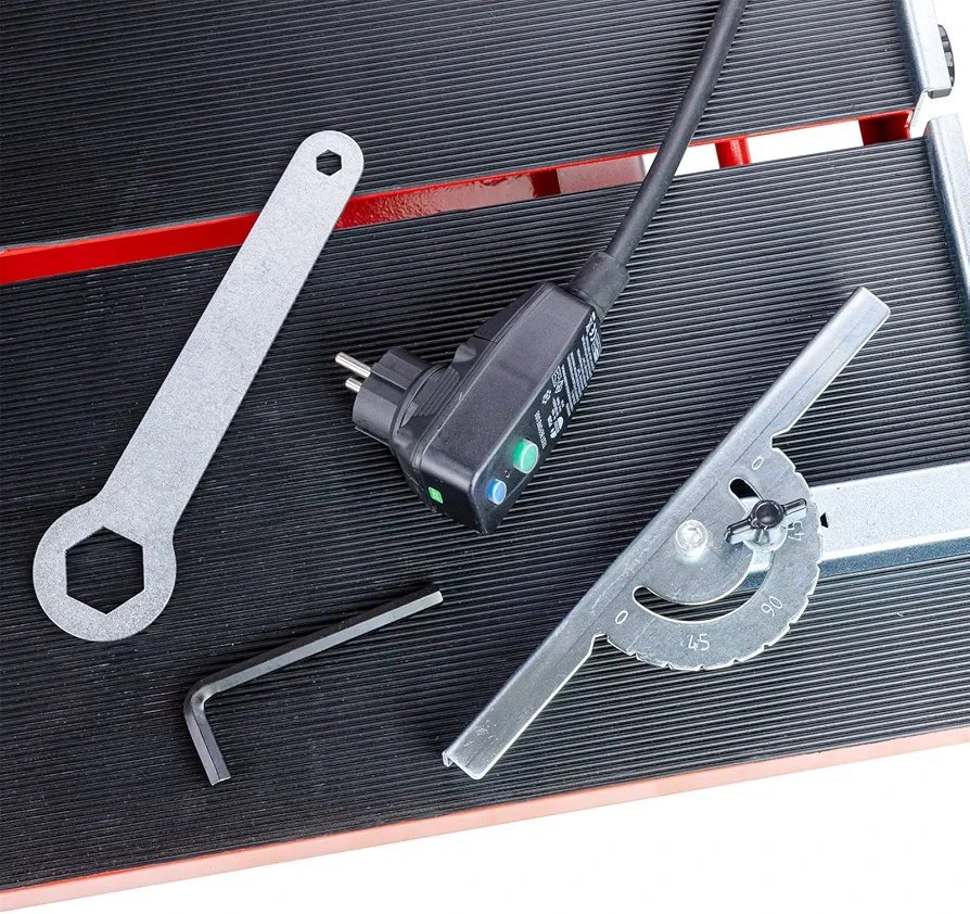 2026/06/1002880733.jpg - pricemagicgh.com Tools for equipment assembly on a ribbed black surface: hex keys, a metal spanner, a power adapter, and a protractor-style angle gauge nearby.